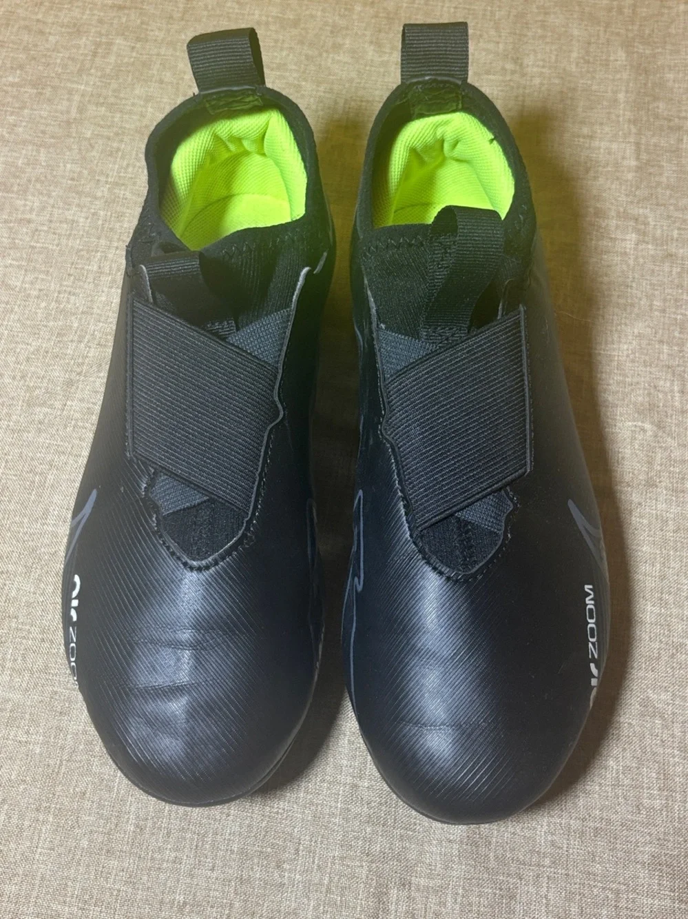 Kid’s Black Athletic Slip-On Cleats with Neon Green Lining